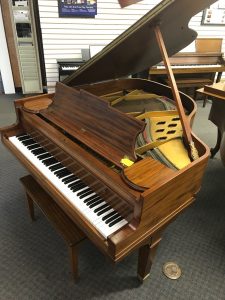 Brown grand piano