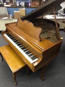 Brown grand piano