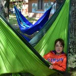 children laying in hammocks