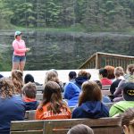 Campers listening to speaker