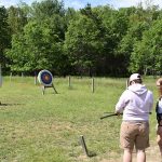 Archery instructor and student