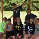 Camp group photo at picnic table